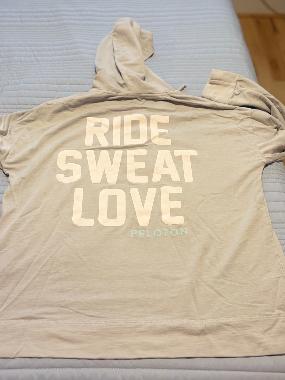 Peloton Beige Hoodie with White Text